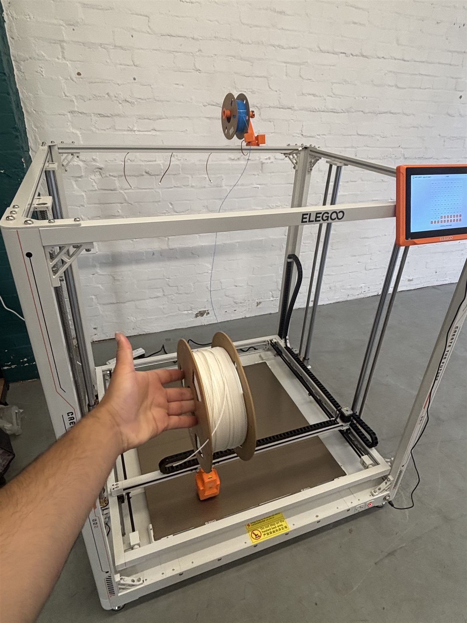 Filament spool held inside the build area for scale
